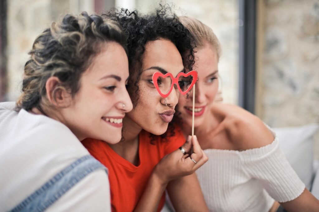 3 female friends disconnected from technology enjoying one another's company