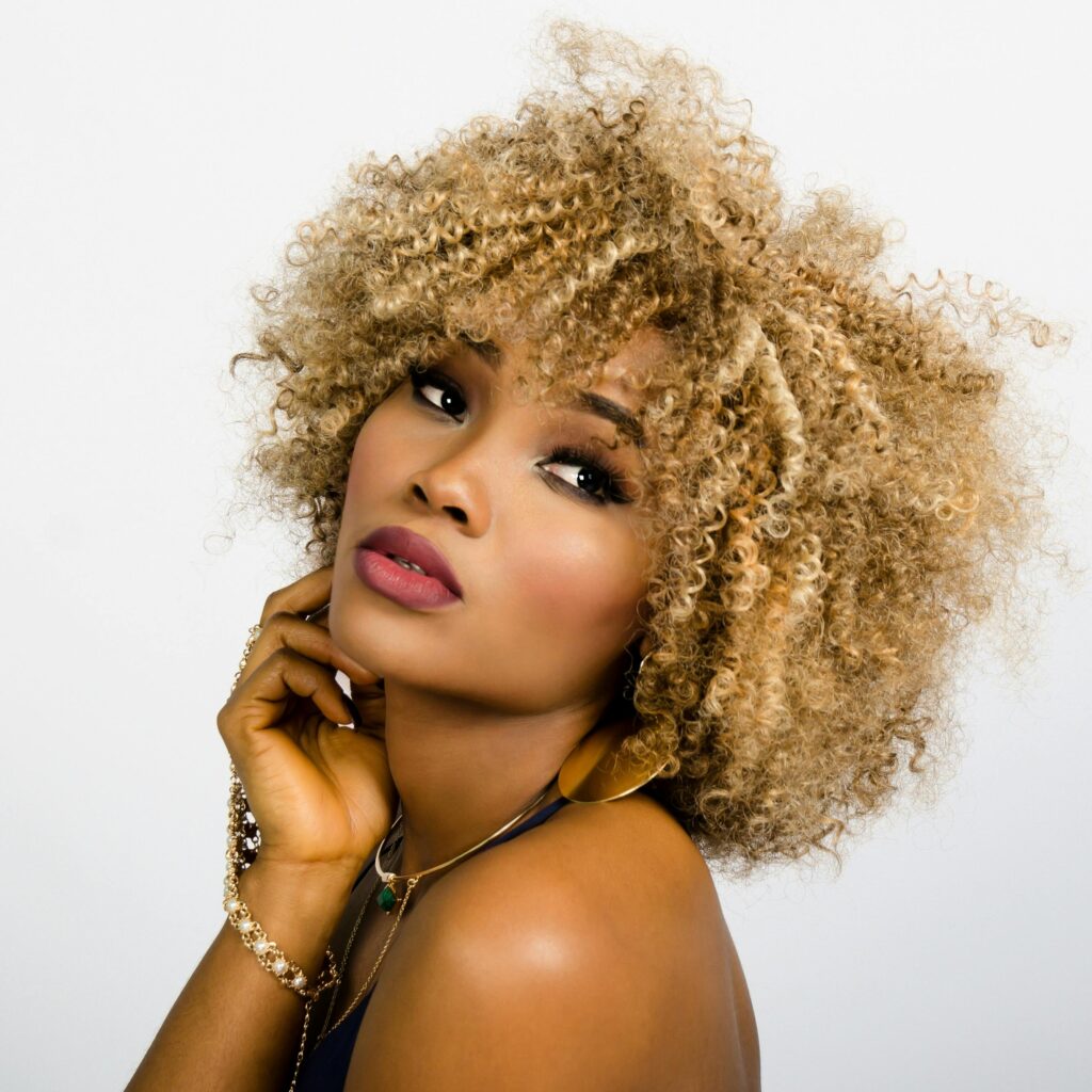 African American female model after using a hydrating skincare product