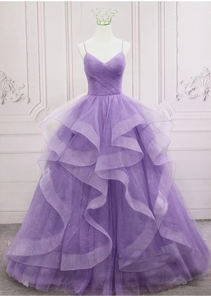 a lilac tulle prom dress hangs on a mannequin