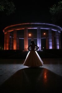 a silhouette of a girl in an A-line gown