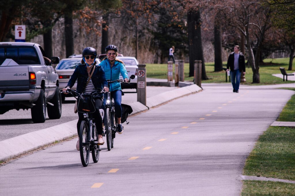 2 women cycling outside