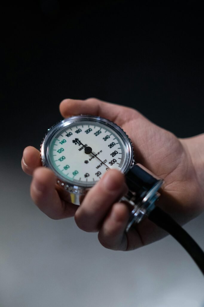 How to Detect High Blood Pressure - a hand hold a sphygmomanometer