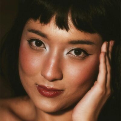 best mask for glass skin -a woman's headshot with beautiful skin