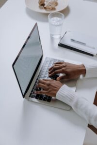 30 day blog challenge (my dream job)- an image of hands on a laptop, blogging