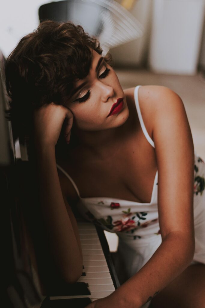 hard usernames -the side profile a beautiful woman in full makeup resting her head on 1 fist