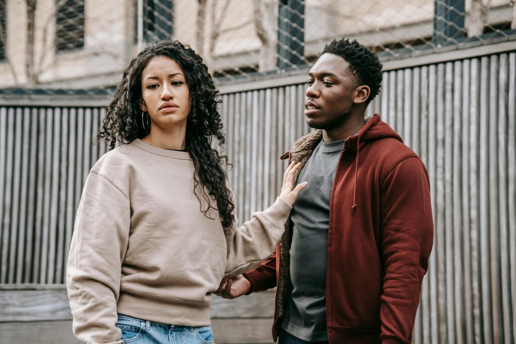 5 signs your relationship is wasting your youth - a couple. The woman looks unhappy and stressed