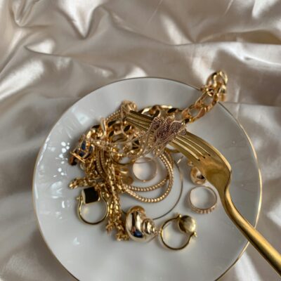 goddess energy usernames - a plate of expensive gold jewelry and a gold fork