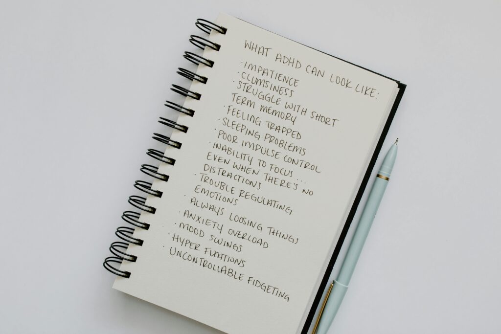 study tips for students with adhd - a notebook with a list of possible ADHD behaviors