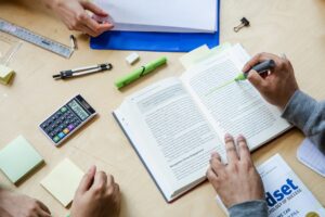 study tips for students with adhd - 3 students studying all you see is hands, highlighters, and books