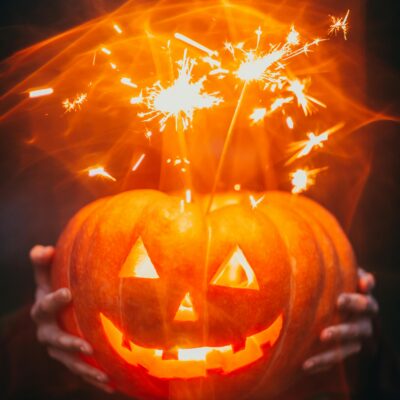 Halloween quotes - a lighted jack-o-latern (Halloween background featured image)