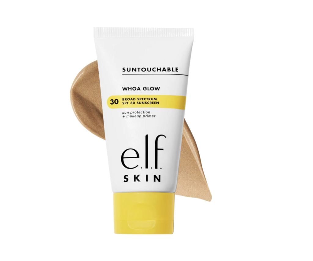White tube of e.l.f. SKIN Suntouchable Whoa Glow SPF 30 sunscreen with a yellow cap, shown with a bronze shimmering sunscreen swatch behind the product.